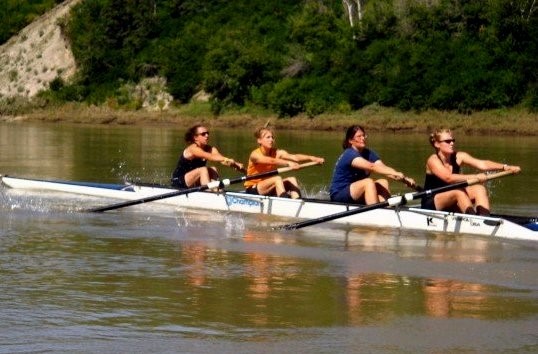 Marlyn competing on her University's rowing team.